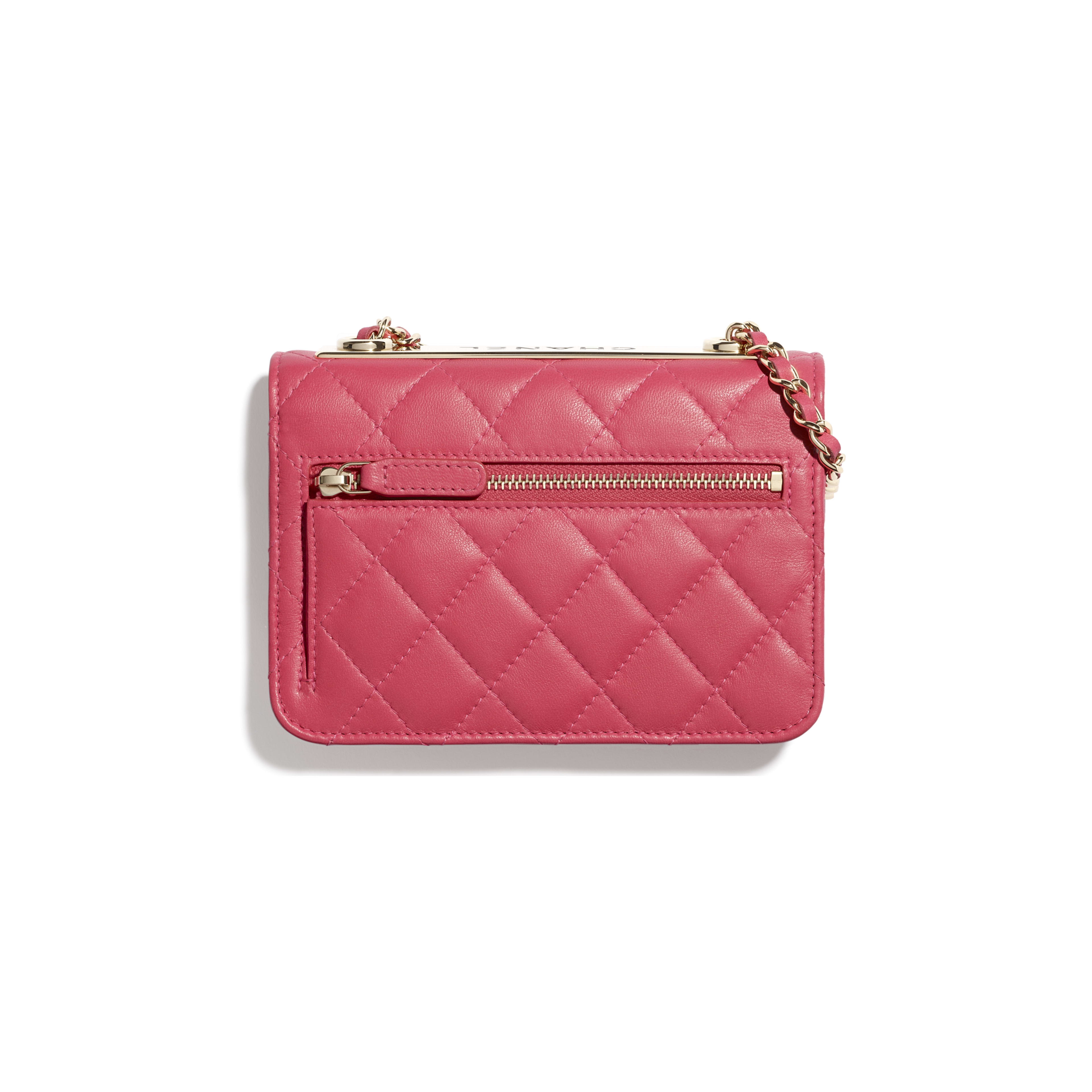 pink and gold clutch
