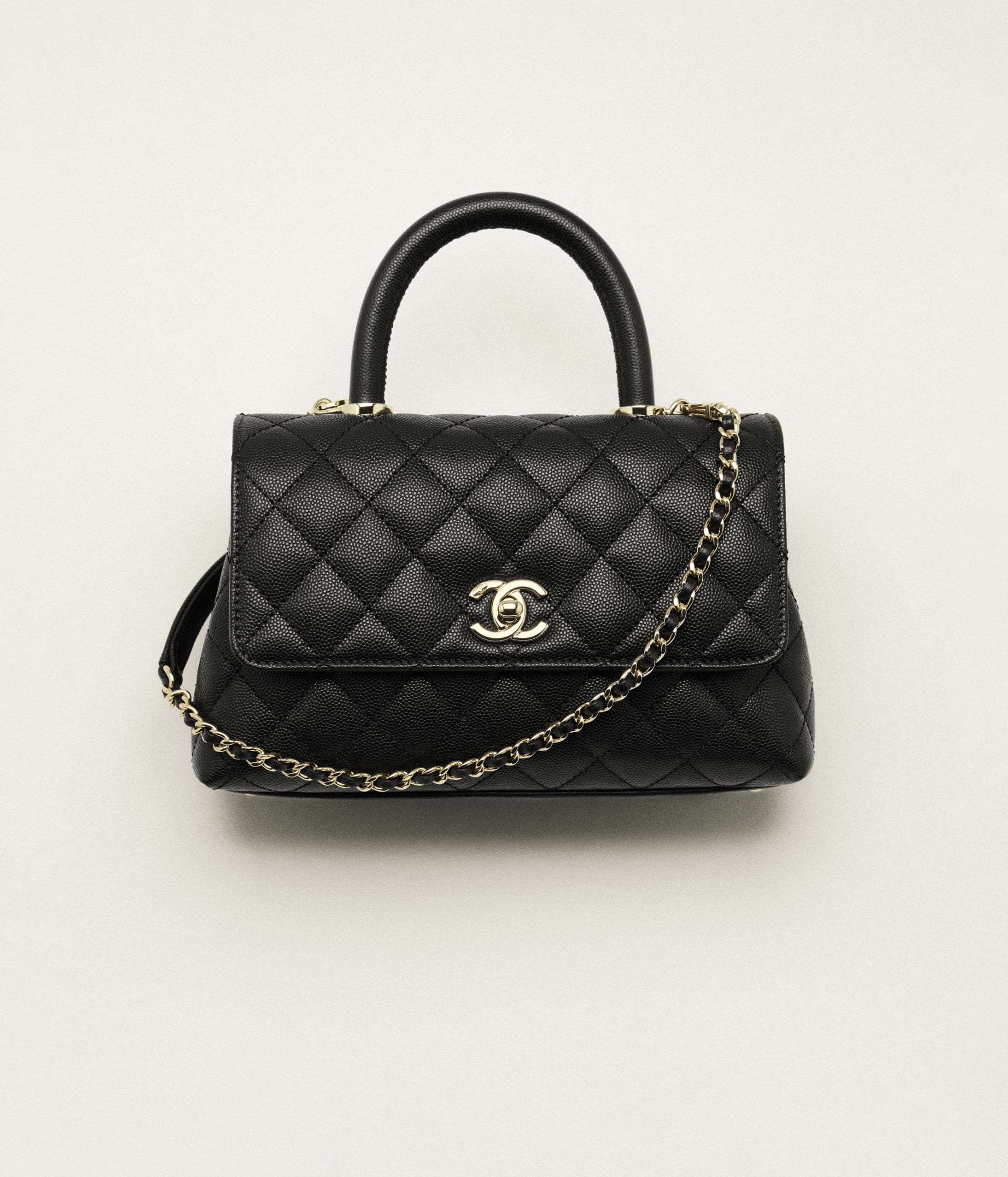 Chanel black flap bag with top handle store
